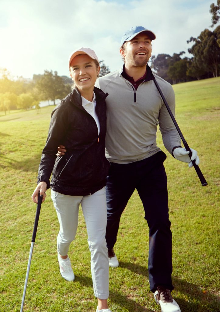 They love golfing Shot of a smiling young couple enjoying a day on the golf course